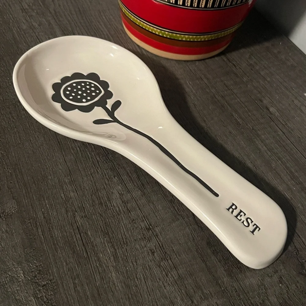 Off-White Ceramic Spoon Rest with Black Sunflower Design